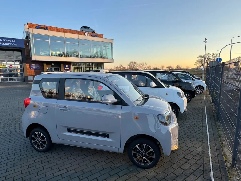 Multiple BAW Pony cars parked in front of BOWIT company headquarter.